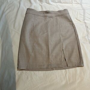 Tan preppy mini skirt from Garage